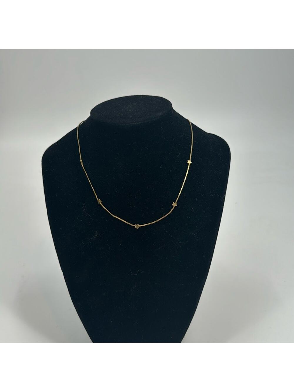 Goldtone star choker necklace